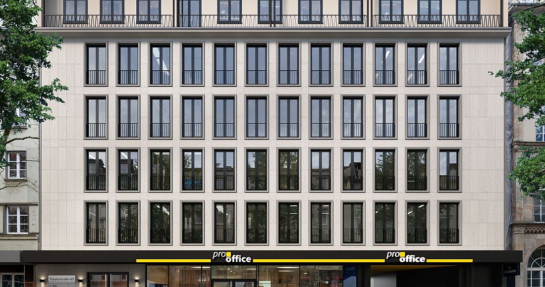 Mehrstöckiges Bürogebäude mit großen Fenstern und 'pro office' Geschäft im Erdgeschoss