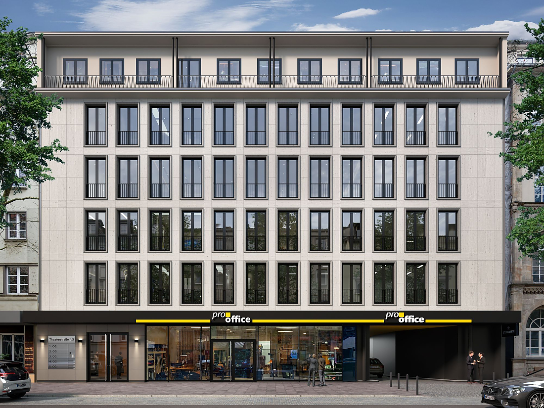 Mehrstöckiges Bürogebäude mit großen Fenstern und 'pro office' Geschäft im Erdgeschoss